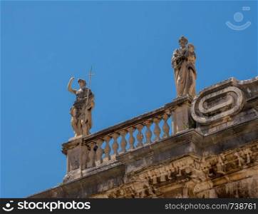 Statues above the entrance to cathedral church in the old town of Dubrovnik in Croatia. Details of statues on roof of cathedral church in Dubrovnik old town
