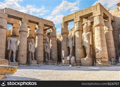 Statues and columns in Luxor temple, Egypt. Statues in Luxor temple