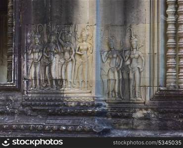 Statues carved on wall of temple, Krong Siem Reap, Siem Reap, Cambodia