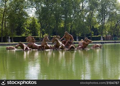 Statues in a pond, Palace of Versailles, Versailles, France