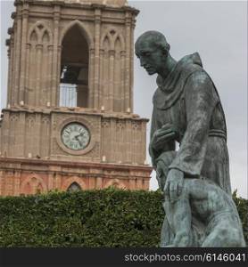Statues in front of clock tower, Zona Centro, San Miguel de Allende, Guanajuato, Mexico