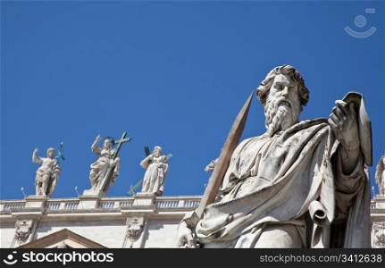Statues in St. Peter Square (Rome, Italy) with blue sky background