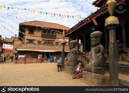 Statues near entrance of temple on the square in Bhaktapur, Nepal