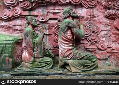 Statues near the wall in Emeishan