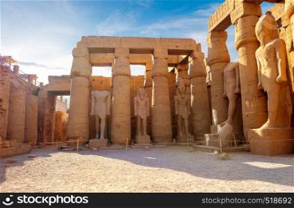 Statues of pharaoh in Karnak temple of Luxor at sunrise