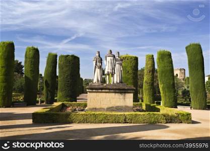 Statues of the Catholic Monarchs (Ferdinand and Isabella) and Christopher Columbus in the gardens of the Alcazar de Cordoba, Spain
