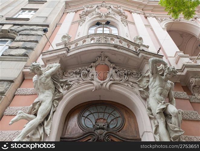 Statues of the man supporting a balcony. Lvov. Ukraine