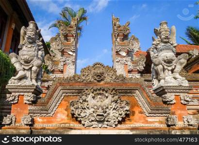 Statues on a temple entrance door in Ubud, Bali, Indonesia. Statues on a temple entrance door, Ubud, Bali, Indonesia