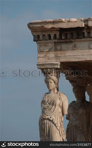 Statues on an ancient historical building in Athens, Greece