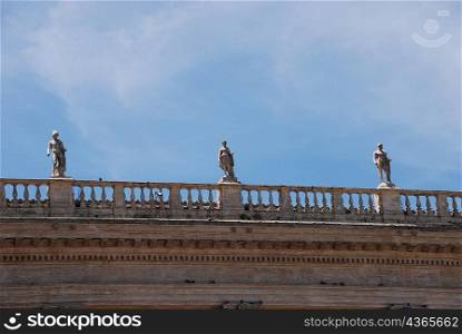 statues on balcony building