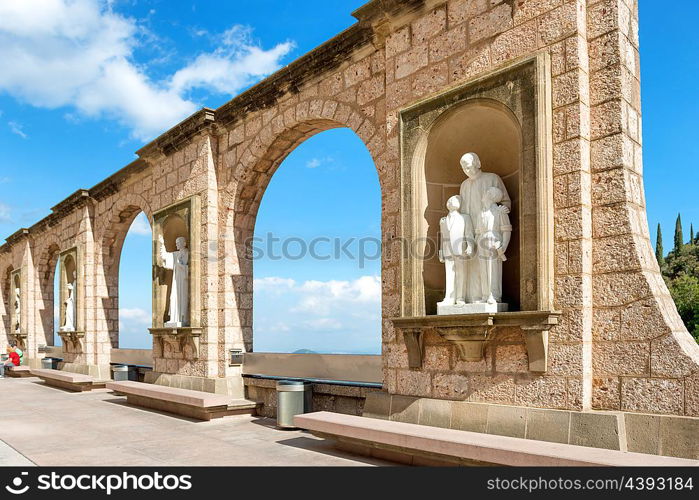 Statues on square in Montserrat monastery in Barcelona, Spain