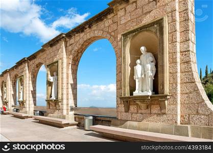 Statues on square in Montserrat monastery in Barcelona, Spain