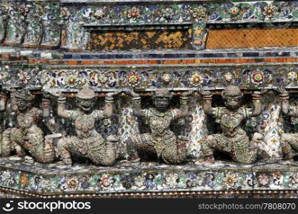 Statues on the prang of wat Arun in Bangkok, Thailand