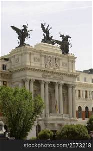 Statues on the top of a government building, Ministry Of Agriculture Building, Madrid, Spain