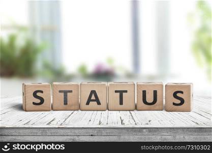 Status sign made of wood on a table in a bright room