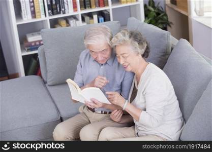 Stay-at-home elderly couple reading books