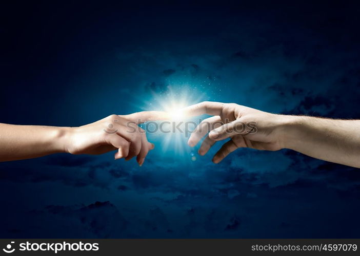 Stay in touch. Close up of human hands reaching each other with fingers