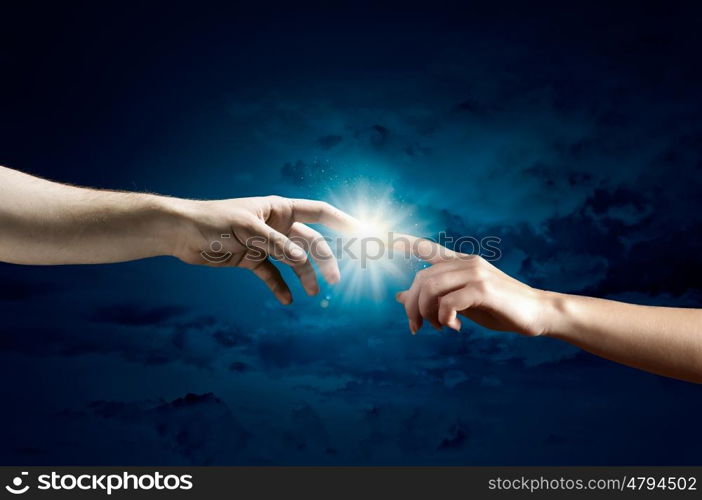 Stay in touch. Close up of human hands reaching each other with fingers