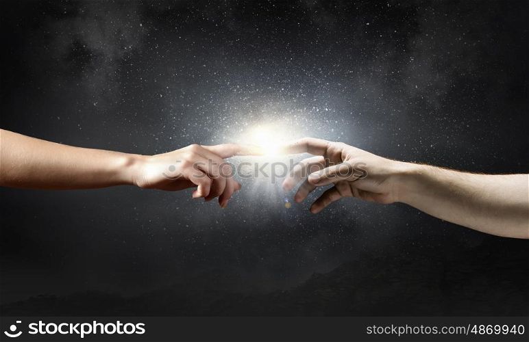 Stay in touch. Close up of human hands reaching each other with fingers
