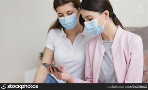 stay indoors women wearing medical masks