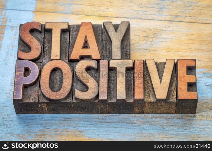 stay positive - motivational word abstract in vintage letterpress printing blocks