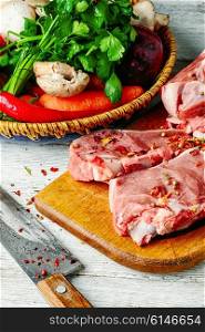 Steak of beef with vegetables preparation for cooking. Raw cut meat