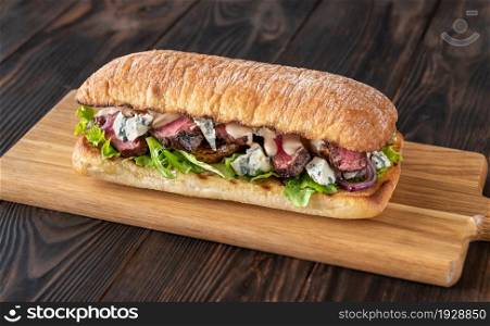 Steak Sandwich with mushrooms, blue cheese, red onions and fresh lettuce