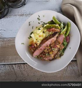 Steak With Mashed Potatoes And Sugar Peas