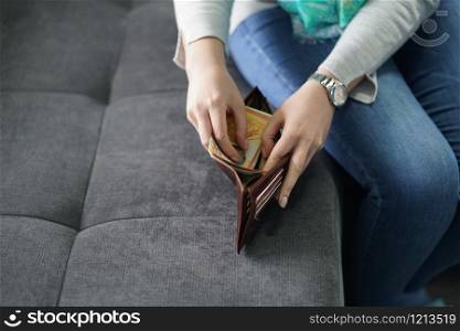 Stealing money from the wallet from husband at home