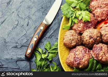 Steam cutlets and sliced vegetables. Diet breakfast,copy space. Homemade dietary meatballs.