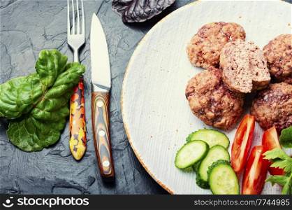Steam cutlets and sliced vegetables. Diet breakfast. Homemade steamed cutlets