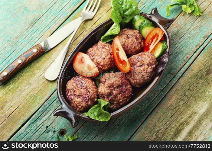 Steam cutlets or rissole and vegetables. Homemade dietary meatballs.. Homemade steamed meatballs
