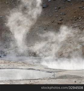 Steam rising from geothermal pools
