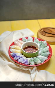 steamed chives dumplings served with spicy chili sauce , asian style cuisine. steamed chives dumplings