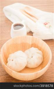 Steamed dumpling stuff on wooden bowl, stock photo