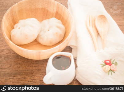 Steamed dumpling stuff on wooden bowl, stock photo