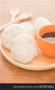 Steamed dumpling stuff on wooden plate, photo