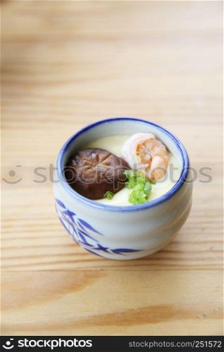 steamed eggs on wood background