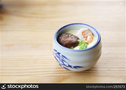 steamed eggs on wood background