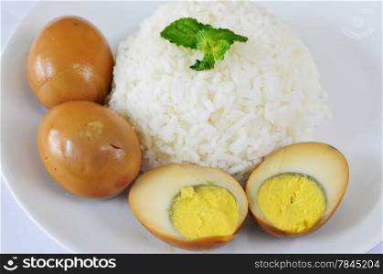 steamed rice served with eggs in brown sauce