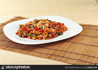 steamed vegetables and meat with peanut on plate. Chinese cuisine.