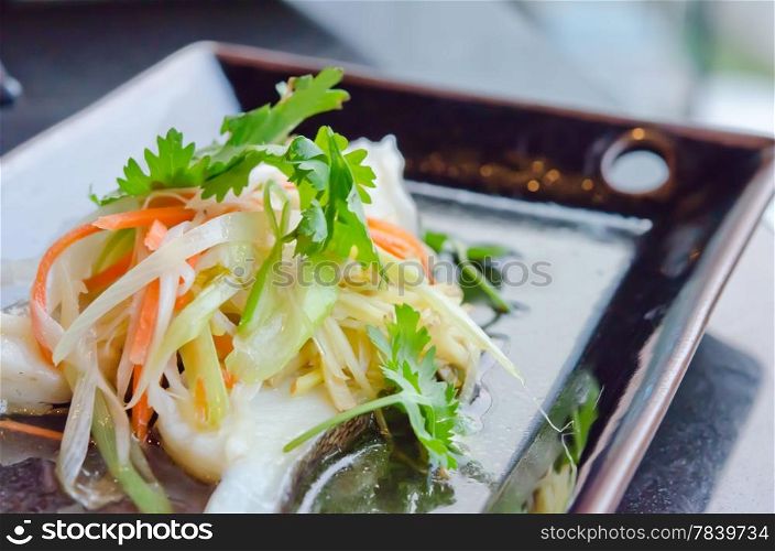 steamed white fish with vegetable on dish