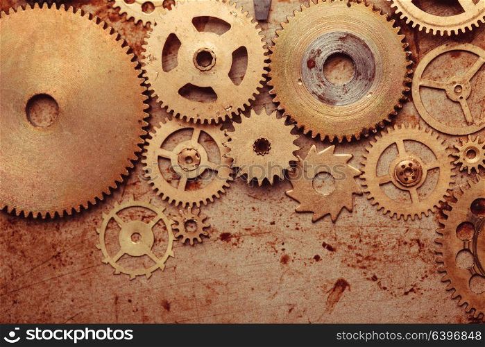 Steampunk background from mechanical clocks details over old metal background. Inside the clock, gears. Steampunk gears background