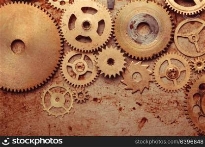Steampunk background from mechanical clocks details over old metal background. Inside the clock, gears. Steampunk gears background