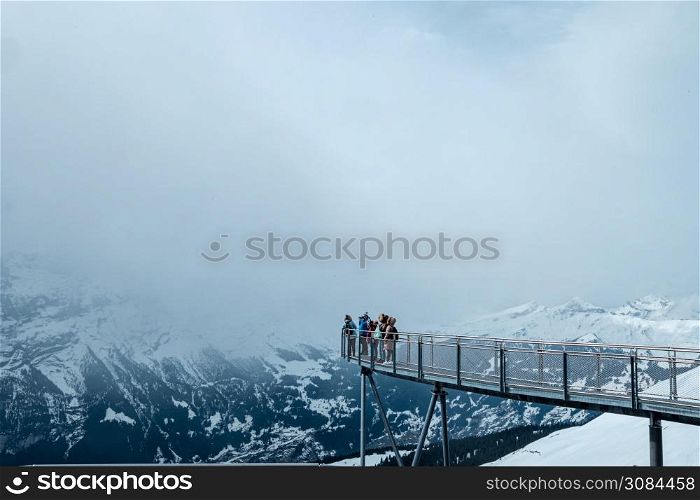 Steel cliff walk over snowy alps at the First station in Grindelwald, Switzerland