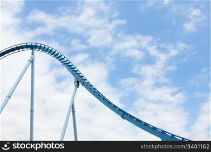 Steel loops of the extreme rollercoaster ride in the amusement park.