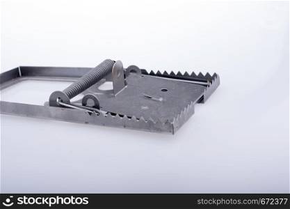 Steel mouse trap in a white background on display