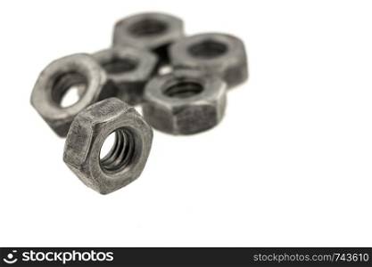 Steel nuts close up isolated on white background