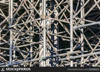 Steel scaffolding for the construction of a building. Construction activity.