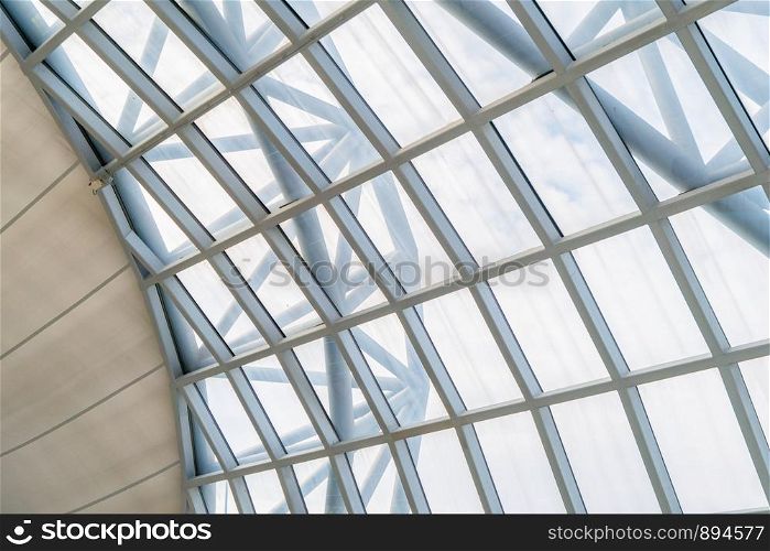 Steel structure of modern office building roof. Metal windows glass facade frames supported. Abstract interior architecture design decoration background.